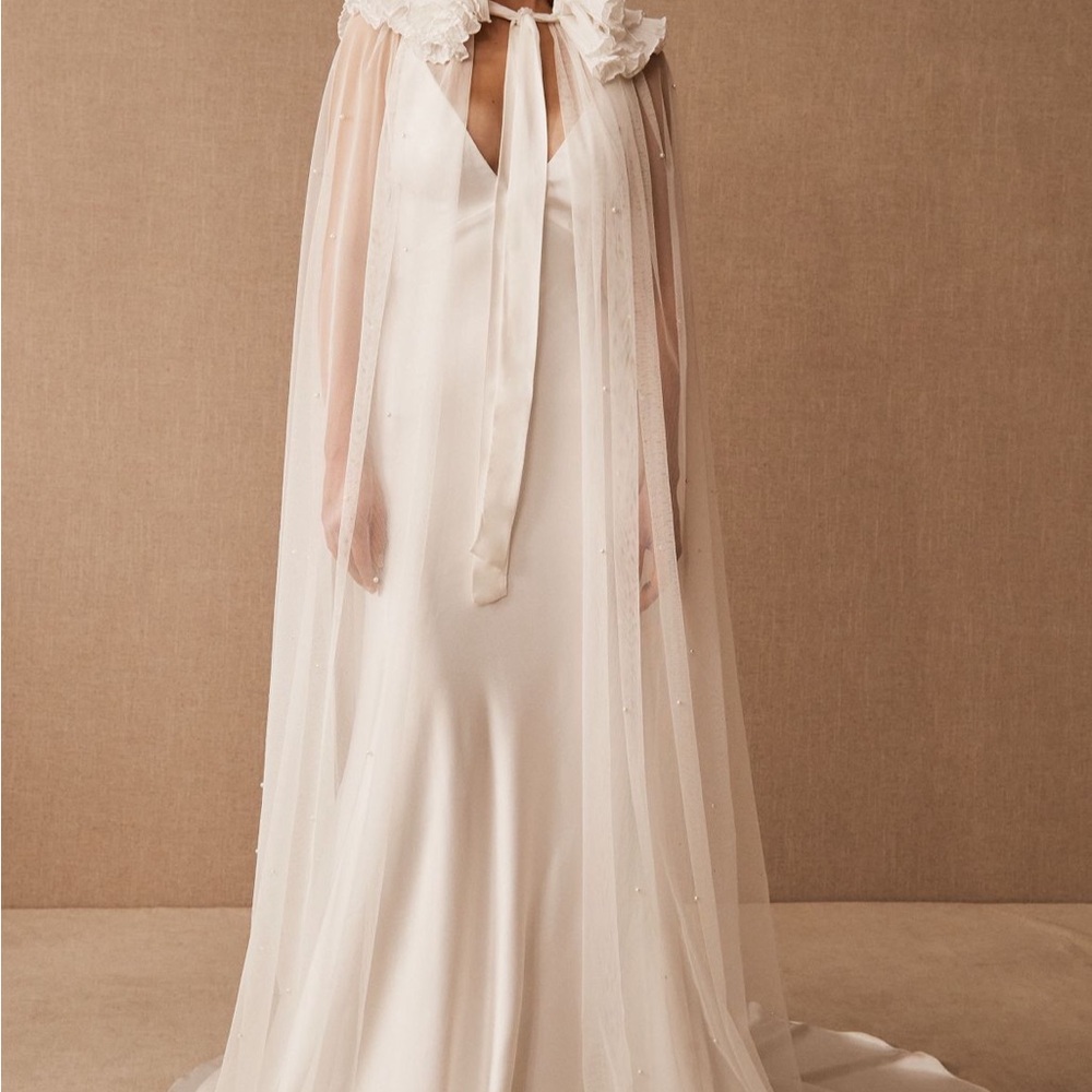 Elegant Cream Gown with Sheer Sleeper Cape